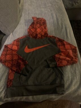 Nike Kids Charcoal Gray Hoodie with Red Graphic Sleeves